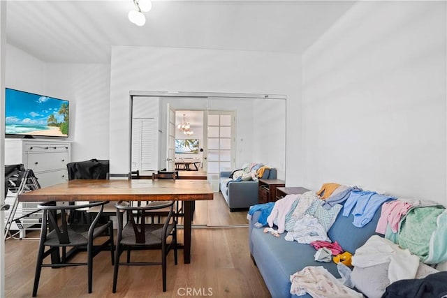 241 S Reeves Dr Unit 302, Beverly Hills, CA 90212 - dining room with wood finished floors and a chandelier