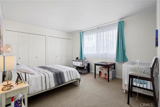 241 S Reeves Dr Unit 302, Beverly Hills, CA 90212 - bedroom featuring multiple closets, carpet flooring, and baseboards