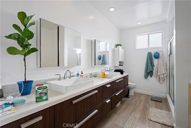 241 S Reeves Dr Unit 302, Beverly Hills, CA 90212 - full bathroom with a shower stall, double vanity, toilet, wood finished floors, and baseboards