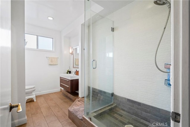 241 S Reeves Dr Unit 302, Beverly Hills, CA 90212 - bathroom with vanity, a stall shower, toilet, and wood finished floors