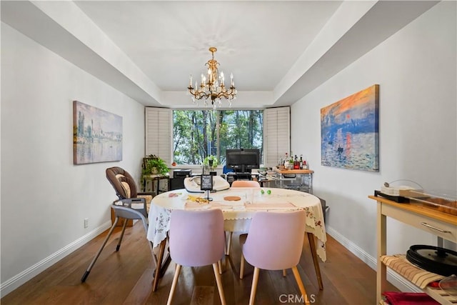 241 S Reeves Dr Unit 302, Beverly Hills, CA 90212 - dining room featuring baseboards, wood finished floors, a chandelier, and a tray ceiling
