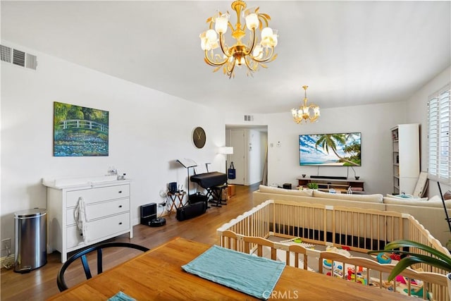 241 S Reeves Dr Unit 302, Beverly Hills, CA 90212 - dining room with a chandelier and wood finished floors