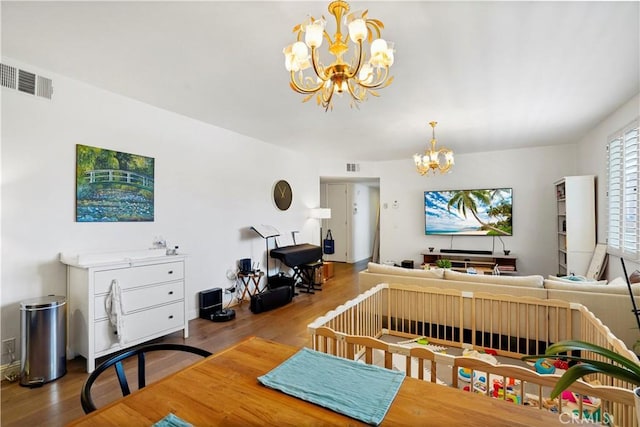 241 S Reeves Dr Unit 302, Beverly Hills, CA 90212 - dining area with a chandelier and wood finished floors