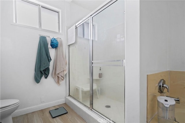 241 S Reeves Dr Unit 302, Beverly Hills, CA 90212 - full bathroom with toilet, a stall shower, wood finished floors, and baseboards