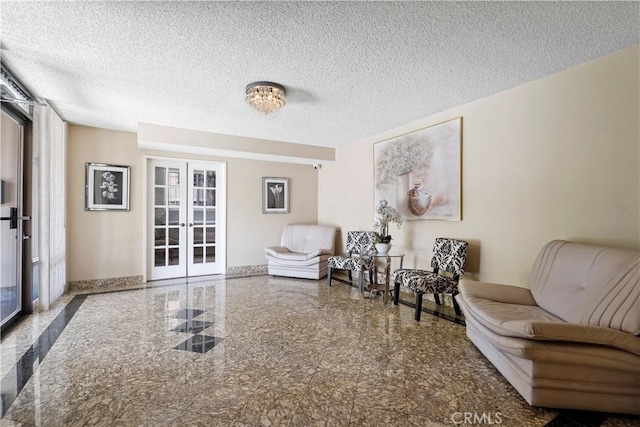 241 S Reeves Dr Unit 302, Beverly Hills, CA 90212 - living area with french doors, granite floors, and a textured ceiling
