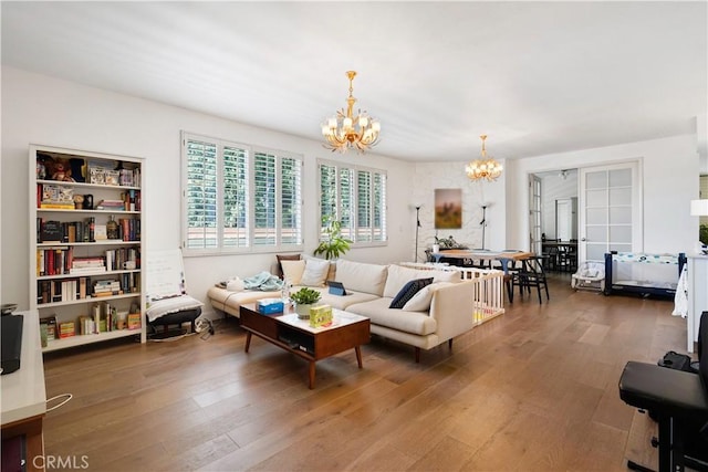 241 S Reeves Dr Unit 302, Beverly Hills, CA 90212 - living area with a chandelier and wood finished floors