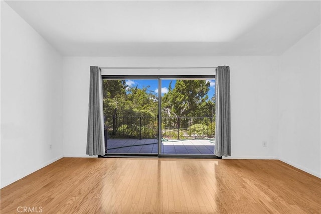 6325 Ridgepath Ct, Rancho Palos Verdes, CA 90275 - empty room featuring wood finished floors, plenty of natural light, and baseboards