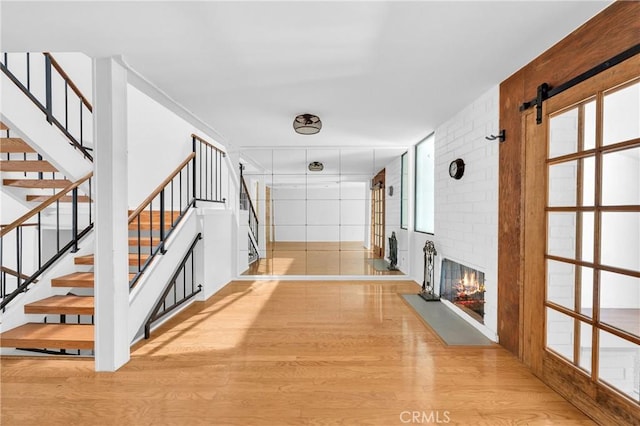 6325 Ridgepath Ct, Rancho Palos Verdes, CA 90275 - corridor with wood finished floors, stairs, and healthy amount of natural light