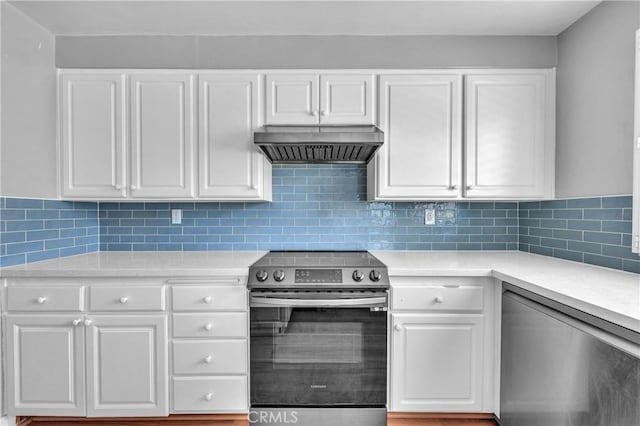 6325 Ridgepath Ct, Rancho Palos Verdes, CA 90275 - kitchen featuring appliances with stainless steel finishes, wall chimney exhaust hood, light countertops, and white cabinetry