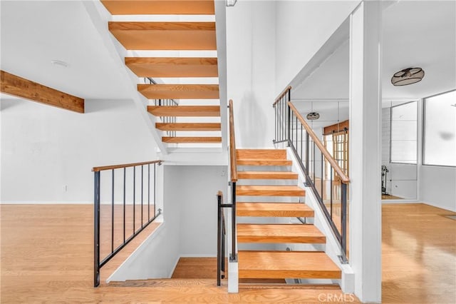 6325 Ridgepath Ct, Rancho Palos Verdes, CA 90275 - stairs with wood finished floors, beam ceiling, and a high ceiling