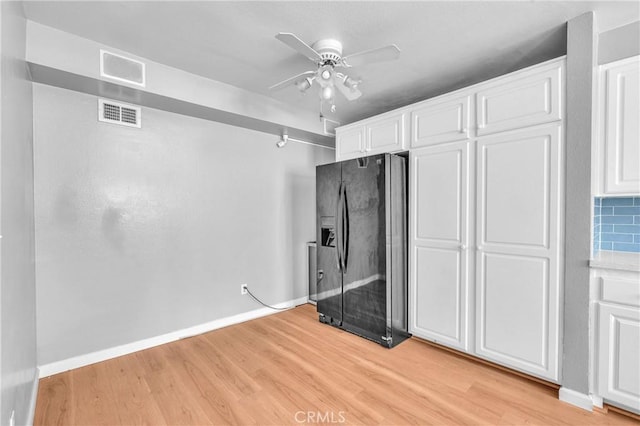 6325 Ridgepath Ct, Rancho Palos Verdes, CA 90275 - kitchen with black refrigerator with ice dispenser, light wood-type flooring, white cabinetry, a ceiling fan, and baseboards