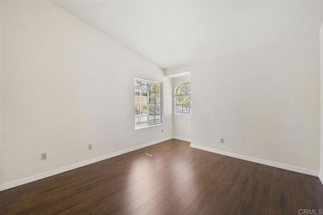 13398 Tiverton Rd, San Diego, CA 92130 - spare room with dark wood finished floors, baseboards, and vaulted ceiling