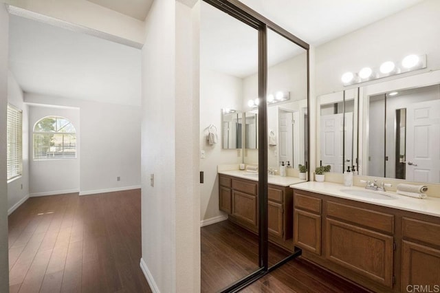 13398 Tiverton Rd, San Diego, CA 92130 - full bath with vanity, wood finished floors, and baseboards