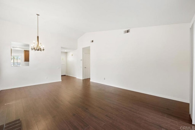13398 Tiverton Rd, San Diego, CA 92130 - empty room with a chandelier, lofted ceiling, dark wood-style flooring, and baseboards