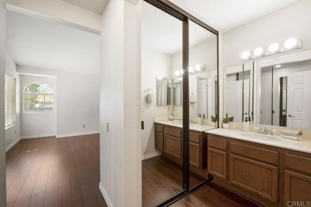 13398 Tiverton Rd, San Diego, CA 92130 - bathroom featuring vanity, wood finished floors, and baseboards