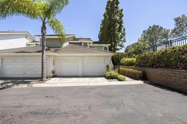 13398 Tiverton Rd, San Diego, CA 92130 - view of front of property featuring an attached garage, driveway, and a tile roof