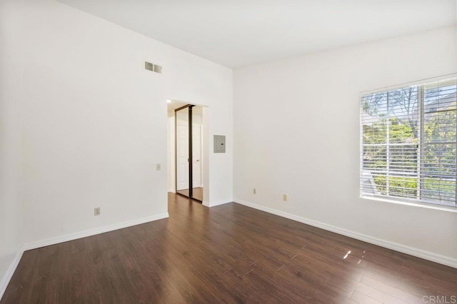 13398 Tiverton Rd, San Diego, CA 92130 - empty room featuring dark wood finished floors, baseboards, and electric panel