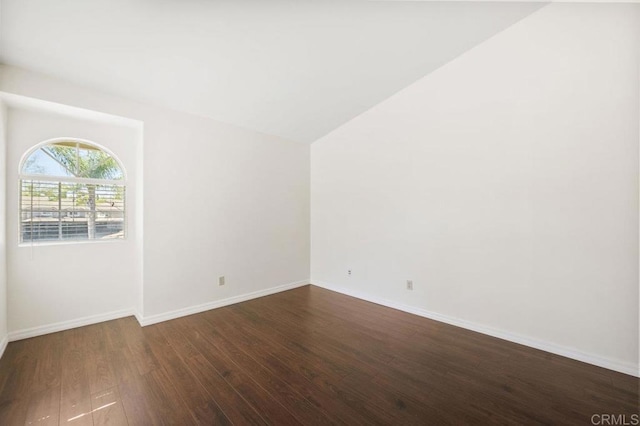 13398 Tiverton Rd, San Diego, CA 92130 - spare room with dark wood finished floors, baseboards, and vaulted ceiling