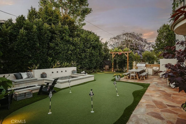 178 Flower St, Costa Mesa, CA 92627 - view of property's community featuring a patio area and an area to practice putting