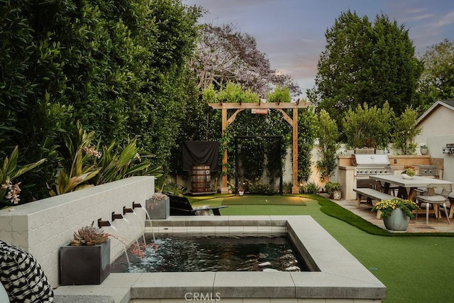 178 Flower St, Costa Mesa, CA 92627 - yard at dusk with area for grilling, a putting green, and a fenced backyard
