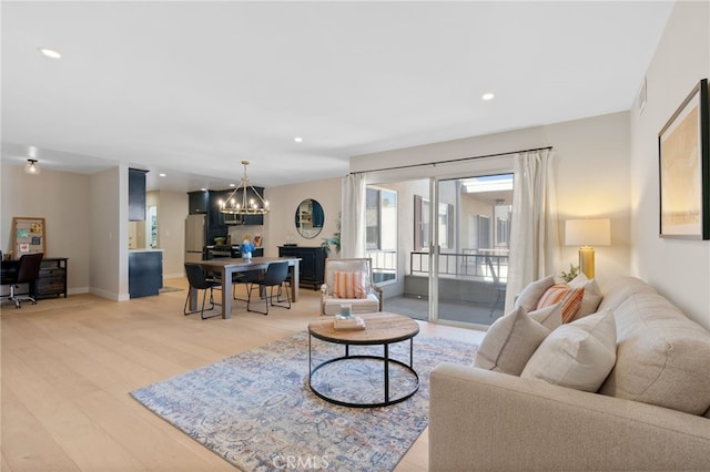 10707 Camarillo St Unit 314, North Hollywood, CA 91602 - living area featuring a chandelier, light wood finished floors, recessed lighting, baseboards, and an office area
