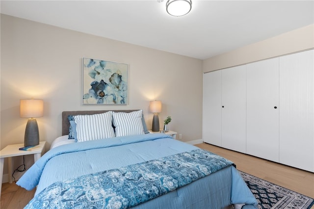 10707 Camarillo St Unit 314, North Hollywood, CA 91602 - bedroom with a closet, baseboards, and wood finished floors
