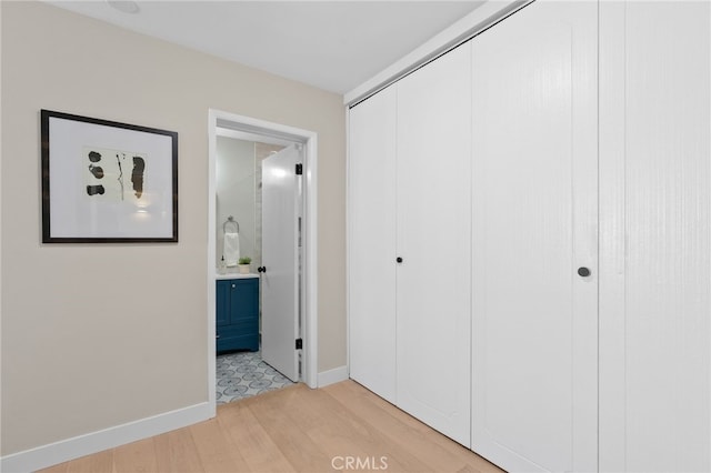 10707 Camarillo St Unit 314, North Hollywood, CA 91602 - corridor featuring light wood finished floors and baseboards