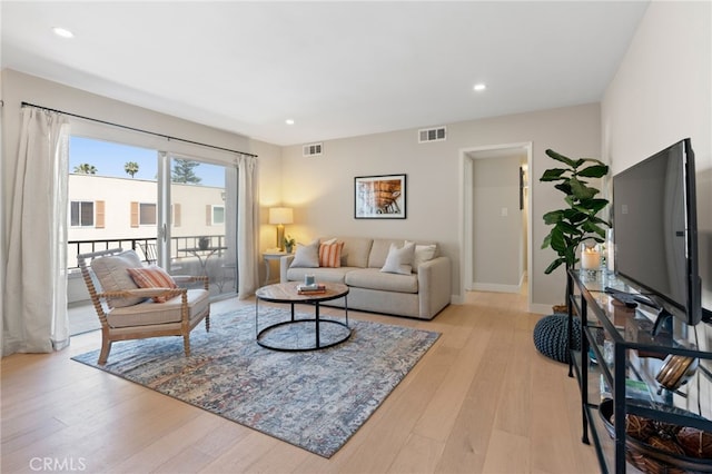 10707 Camarillo St Unit 314, North Hollywood, CA 91602 - living area with light wood-type flooring, recessed lighting, and baseboards