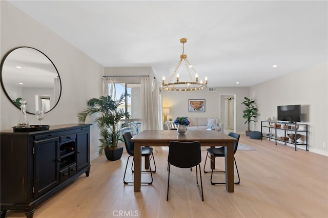 10707 Camarillo St Unit 314, North Hollywood, CA 91602 - dining space with a chandelier, light wood finished floors, recessed lighting, and baseboards