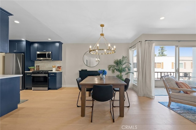 10707 Camarillo St Unit 314, North Hollywood, CA 91602 - dining space featuring a chandelier, light wood-type flooring, recessed lighting, and baseboards