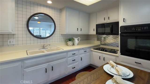13800 Annandale Dr Unit 37A, Seal Beach, CA 90740 - kitchen featuring black appliances, a sink, decorative backsplash, and light countertops
