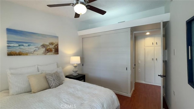 13800 Annandale Dr Unit 37A, Seal Beach, CA 90740 - bedroom featuring wood finished floors, baseboards, a closet, and a ceiling fan
