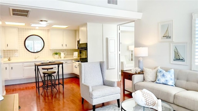 13800 Annandale Dr Unit 37A, Seal Beach, CA 90740 - living room featuring wood finished floors and healthy amount of natural light