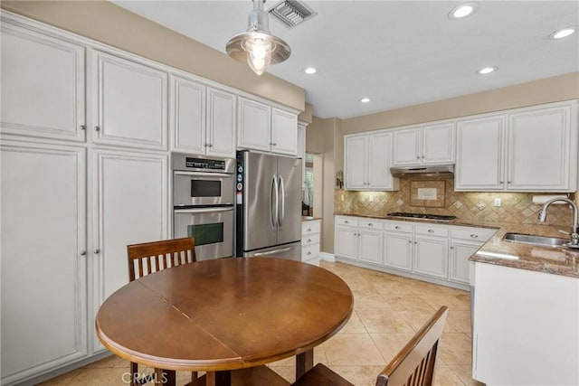 27360 Chesterfield Dr, Valencia, CA 91354 - kitchen with appliances with stainless steel finishes, a sink, under cabinet range hood, white cabinetry, and recessed lighting