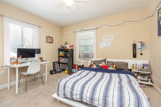 2712 Kenwood Ave, Los Angeles, CA 90007 - bedroom with multiple windows, baseboards, and carpet flooring