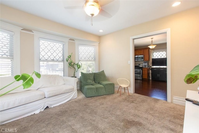 2712 Kenwood Ave, Los Angeles, CA 90007 - living area with dark colored carpet, a ceiling fan, recessed lighting, and baseboards
