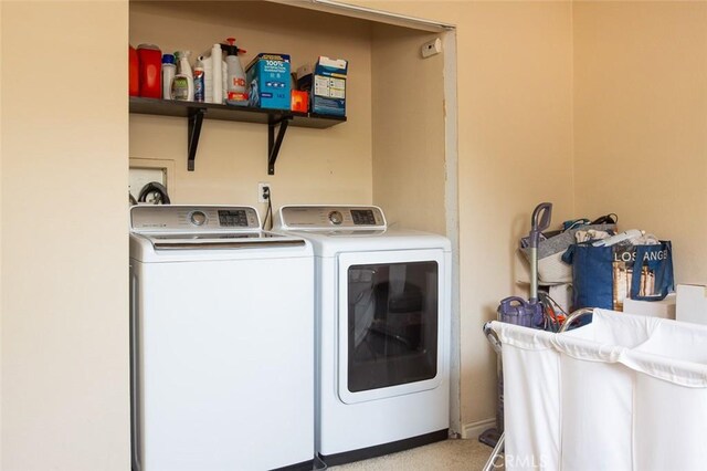 2712 Kenwood Ave, Los Angeles, CA 90007 - laundry room featuring separate washer and dryer and baseboards