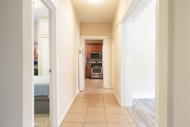 2712 Kenwood Ave, Los Angeles, CA 90007 - hallway featuring light tile patterned floors and baseboards