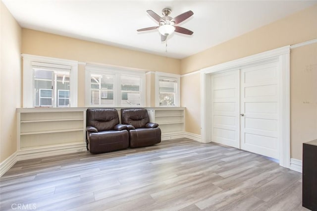 2712 Kenwood Ave, Los Angeles, CA 90007 - living area featuring light wood-style flooring, a ceiling fan, and baseboards