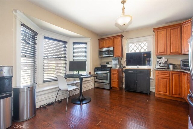 2712 Kenwood Ave, Los Angeles, CA 90007 - kitchen with appliances with stainless steel finishes, brown cabinets, dark wood-style flooring, an office area, and decorative light fixtures