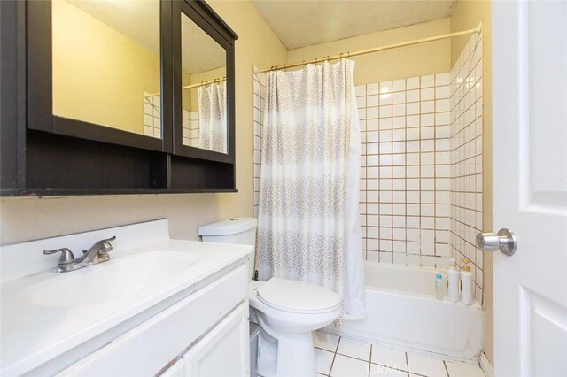 2712 Kenwood Ave, Los Angeles, CA 90007 - bathroom featuring toilet, vanity, tile patterned flooring, and shower / bath combination with curtain