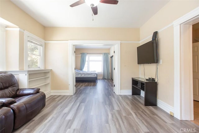 2712 Kenwood Ave, Los Angeles, CA 90007 - living room with baseboards, ceiling fan, and wood finished floors