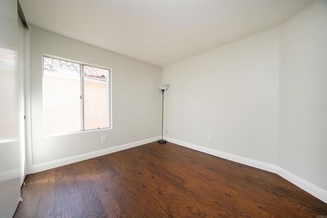1688 Crystal Ridge Ct, Vista, CA 92081 - unfurnished room with baseboards and dark wood-type flooring