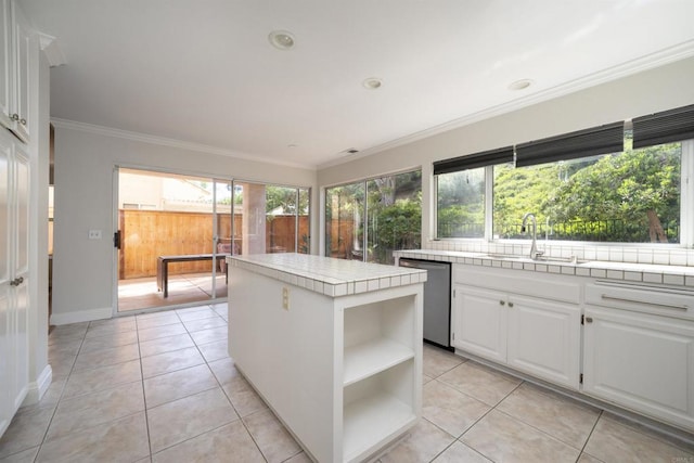 1688 Crystal Ridge Ct, Vista, CA 92081 - kitchen with dishwasher, a sink, tile counters, open shelves, and white cabinets