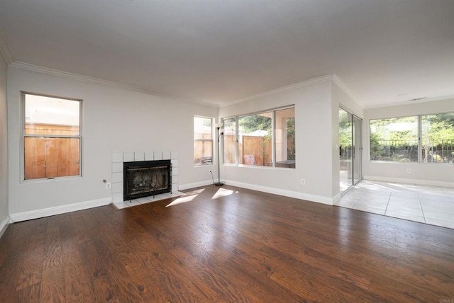 1688 Crystal Ridge Ct, Vista, CA 92081 - unfurnished living room featuring a fireplace, baseboards, crown molding, and wood finished floors