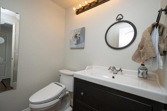 1688 Crystal Ridge Ct, Vista, CA 92081 - half bathroom featuring vanity and toilet