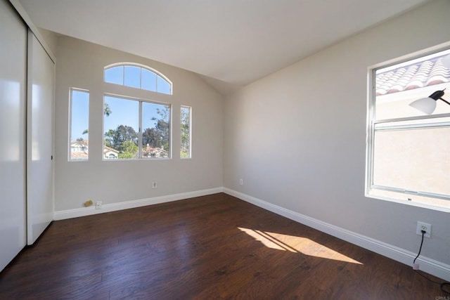 1688 Crystal Ridge Ct, Vista, CA 92081 - spare room featuring dark wood-style floors, baseboards, and vaulted ceiling