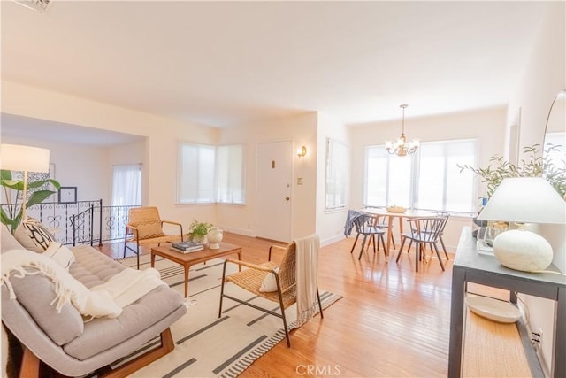 1532 N Lima St, Burbank, CA 91505 - living room with a chandelier, light wood-style flooring, and baseboards