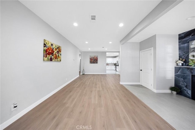 404 E Kingsley Ave, Pomona, CA 91767 - unfurnished living room featuring light wood-style flooring, recessed lighting, and baseboards