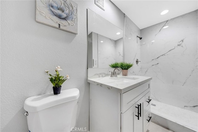 404 E Kingsley Ave, Pomona, CA 91767 - bathroom featuring toilet, vanity, a marble finish shower, and recessed lighting